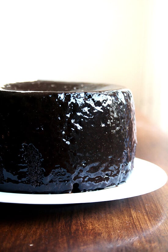 Double Chocolate Cake with Black Velvet Icing on a plate, ready to be sliced. 