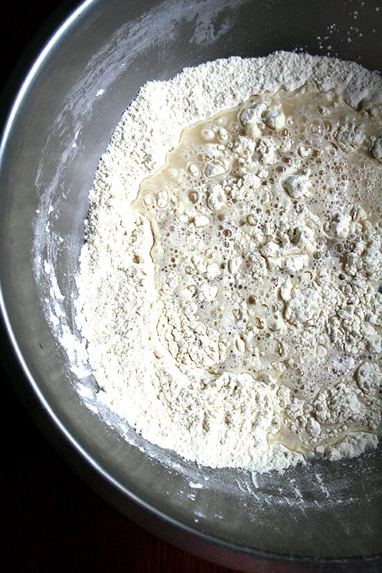 Overhead view of unmixed dough in mixing bowl