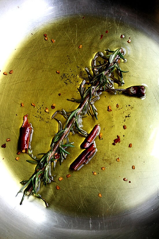 rosemary and chile de arbol sizzling in olive oil