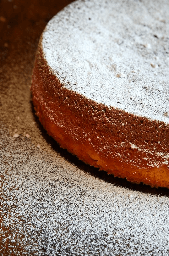 Chez Panisse almond torte dusted with powdered sugar. 