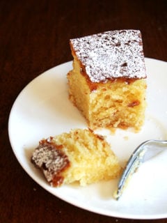 A slice of almond torte on a plate.