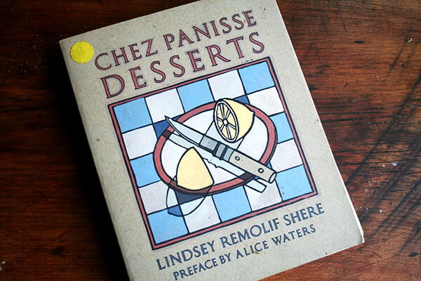 Chez Panisse Desserts cookbook on a table. 