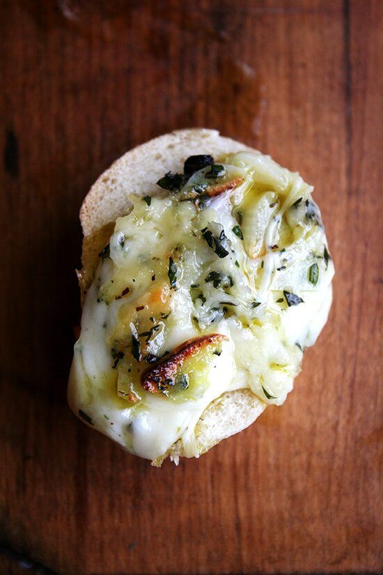 Super easy to put together and a guaranteed crowd pleaser, this baked fontina is definitely a good one to know this time of year. When served to company, not a morsel of this bubbling fontina-herb-and-garlic-filled cast-iron skillet will ever remain. Serve with crispy kale chips and radishes with sea salt. // alexandracooks.com