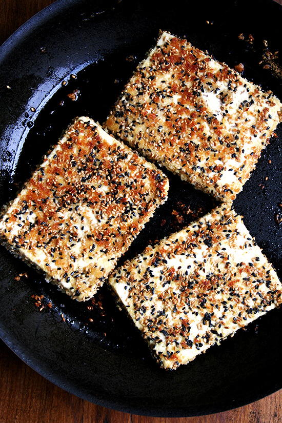 crisping the tofu in a skillet