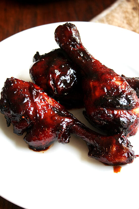 A plate of honey-soy oven-baked chicken drumsticks. 