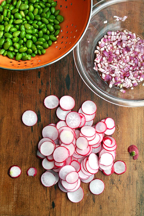 In this edamame and radish salad, radishes and edamame are in nearly equal proportion by volume, and the dressing is simple: equal parts olive oil and vinegar and a good sprinkling of salt — both the radishes and the edamame can handle it. It's a cinch to throw together. High in protein, light, colorful, satisfying — what's not to love here? And it's a great way to use up those CSA radishes to boot! // alexandracooks.com