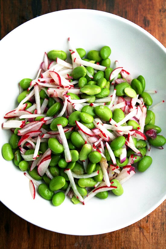 In this edamame and radish salad, radishes and edamame are in nearly equal proportion by volume, and the dressing is simple: equal parts olive oil and vinegar and a good sprinkling of salt — both the radishes and the edamame can handle it. It's a cinch to throw together. High in protein, light, colorful, satisfying — what's not to love here? And it's a great way to use up those CSA radishes to boot! // alexandracooks.com