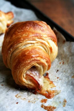 a baked ham and cheese croissant