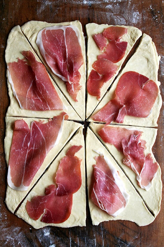 Croissant dough, rolled out, cut into triangles, top with slices of smoked ham.