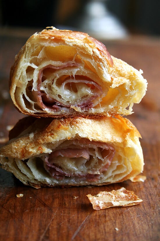 A halved ham and cheese croissant. 