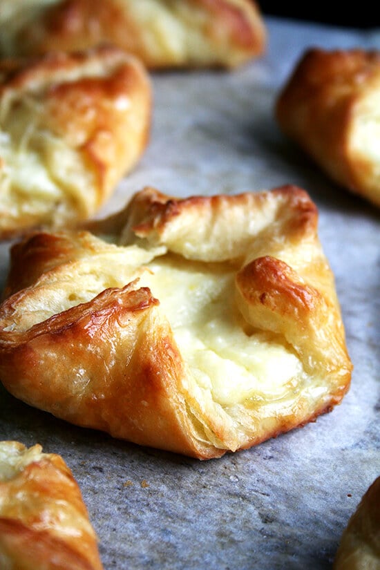 A freshly baked cheese Danish on a sheet pan. 