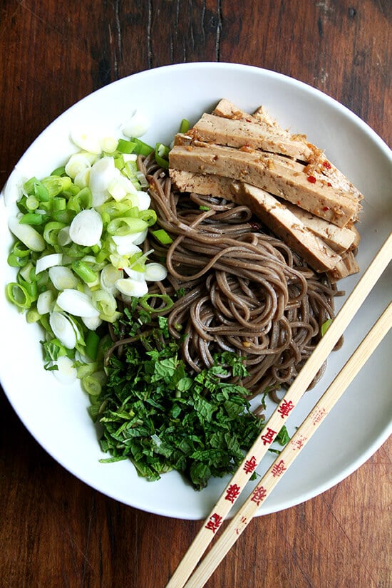 In this soba noodle salad, both the tofu and noodles are dressed with the same ginger and garlic soy-based dressing. It's a great dressing to use with any number of Asian noodles, but it excels in one area in particular: complete tofu domination. // alexandracooks.com