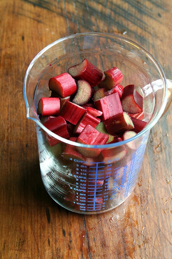 A measuring cup filled with chopped rhubarb. 
