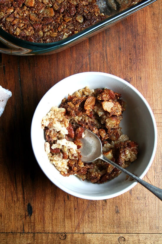 A bowl of baked steel cut oatmeal, flavored with cinnamon, maple, and almonds.