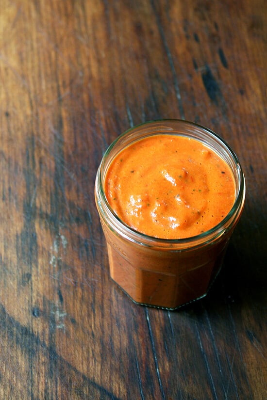 A simple red pepper tomato sauce: tomatoes, bell peppers and water cooked down until nearly all of the water evaporates and the tomatoes and bell peppers and basil reduce into a sweet, summery concentrate. // alexandracooks.com