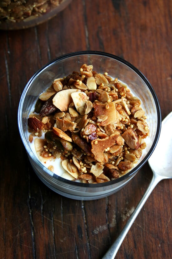 It comes as no surprise then that I absolutely adore this toasted muesli. Like granola, the oat mixture is toasted with a little oil — three tablespoons of olive oil — and a sweetener — a half cup of maple syrup. Like muesli, the mixture can be bulked up with dried fruit and puffed cereal or other grains and nuts. A healthy scoop of millet offers the nicest crunch, and the lightly toasted mixture, less sweet than granola, can be enjoyed with milk or yogurt alike. // alexandracooks.com