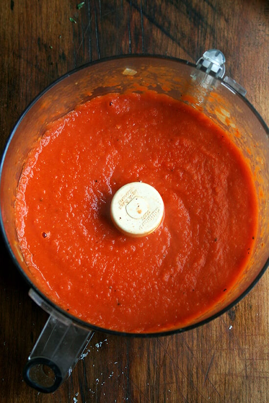 Puréed tomatoes, onions, vodka in food processor.