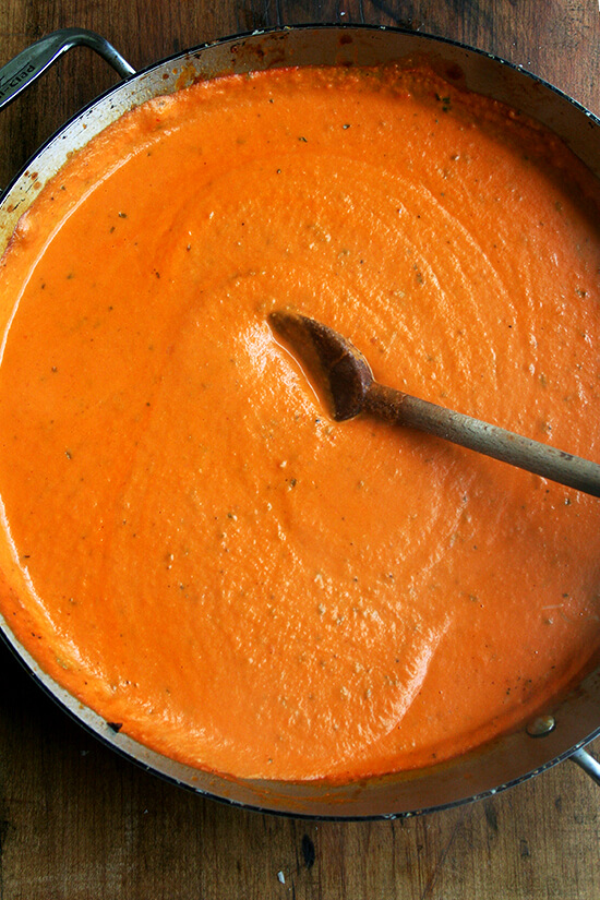 Overhead close-up of the sauce with wooden spoon