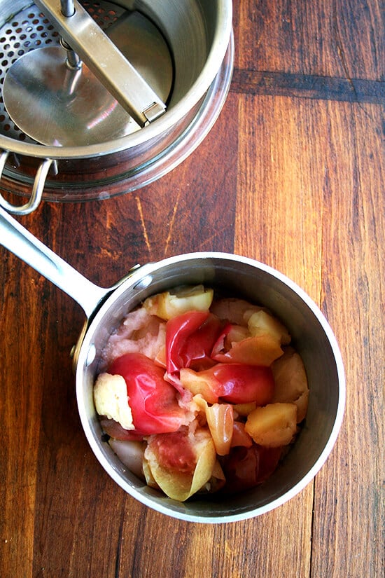 Cooked apples in pot.
