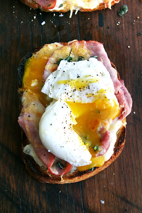 Croque madame: Toast slicked with béchamel, topped with ham, Gruyère, and a perfect poached egg.
