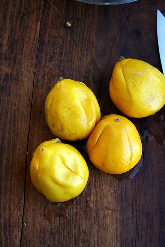 Four boiled lemons with slits in them. 