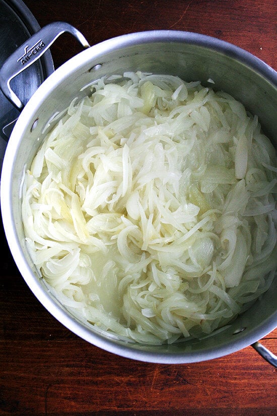 onions, after 30 minutes of cooking, covered in a large pot
