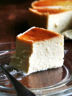 A half-eaten slice of lemon-ricotta cheesecake