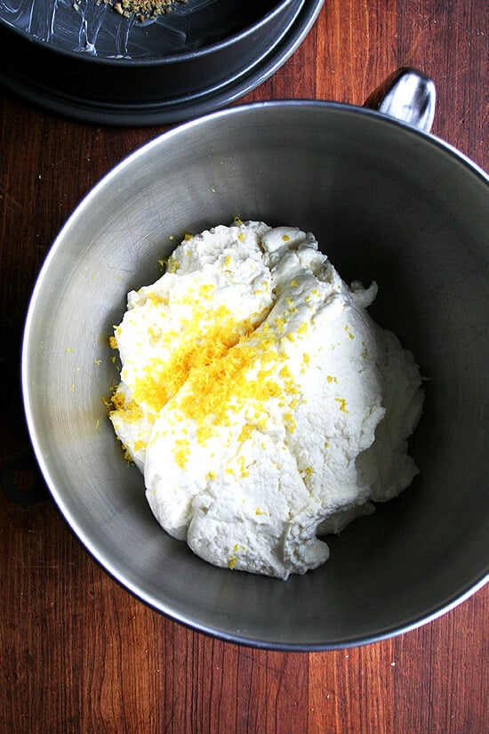 Lemon zest & ricotta in the bowl of a stand mixer. 