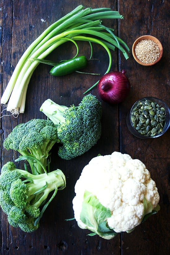 ingredients for broccoli-cauliflower salad on a board