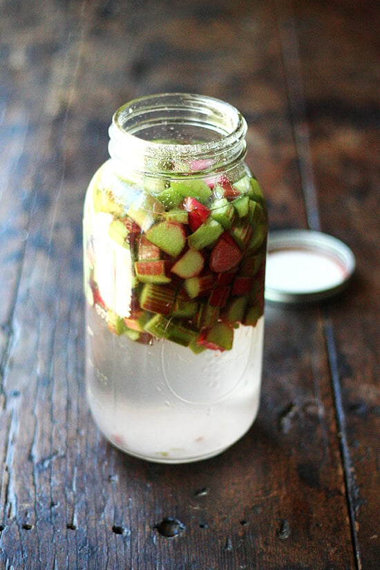 Jar of rhubarb schnapps in the making: chopped rhubarb, sugar, vodka. 