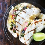 I served this grilled pablanos salsa with grilled, diced New York Strip steak, but skirt, hanger or flank would be really nice, too. And while meat, especially with occasions like Father's Day in mind, feels like a must, with this salsa on the table, I find myself forgetting the meat altogether, loading up tortilla after tortilla with as much salsa as each can bear, piling on diced avocado and dollops of sour cream. Never have tacos disappeared so quickly. // alexandracooks.com
