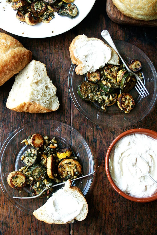 plates of summer squast sauté, homemade bread, and ricotta