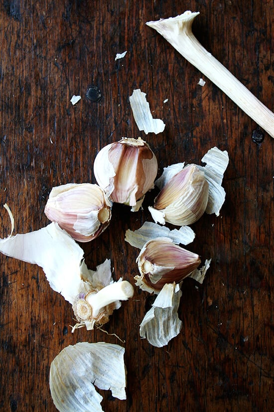 A head of garlic split into cloves. 