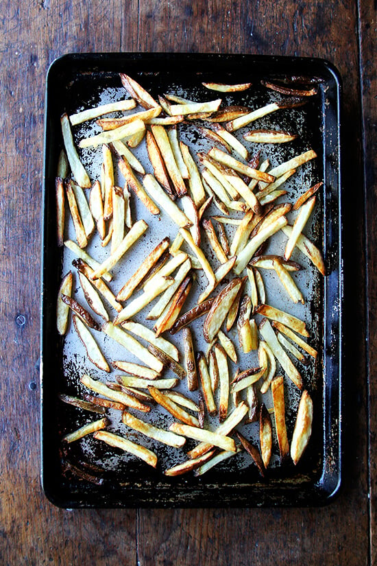 A sheet pan of homemade French fries. 