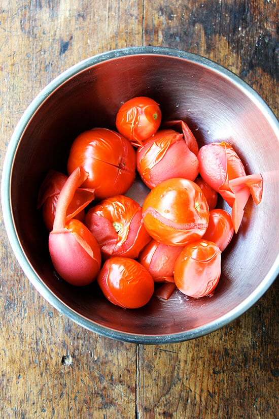 Blanched tomatoes in a bowl. 