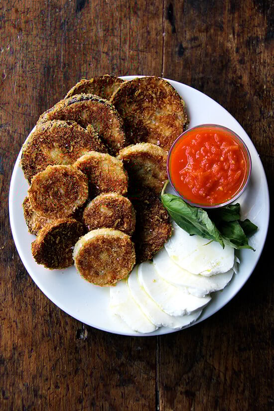 These crispy rounds of eggplant parmesan are irresistible, and with a few slices of cheese, some bread, sauce, maybe some prosciutto or other cured meats, you can make a meal out of them. Little ones, teary eyed or otherwise, seem to like them, too. // alexandracooks.com