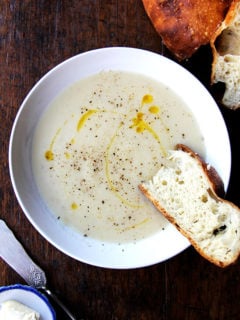 Soup season has officially arrived, bringing with it bowls of warm, comforting goodness, smells that permeate the house, the nourishment we crave on chilly days, and blisters to our little, out-of-practice fingers. This parsnip pear soup is perfect for this time of year. // alexandracooks.com