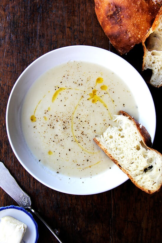 Soup season has officially arrived, bringing with it bowls of warm, comforting goodness, smells that permeate the house, the nourishment we crave on chilly days, and blisters to our little, out-of-practice fingers. This parsnip pear soup is perfect for this time of year. // alexandracooks.com