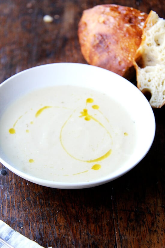 Soup season has officially arrived, bringing with it bowls of warm, comforting goodness, smells that permeate the house, the nourishment we crave on chilly days, and blisters to our little, out-of-practice fingers. This parsnip pear soup is perfect for this time of year. // alexandracooks.com