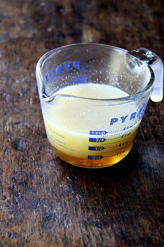 A liquid measuring cup filled with maple butter. 