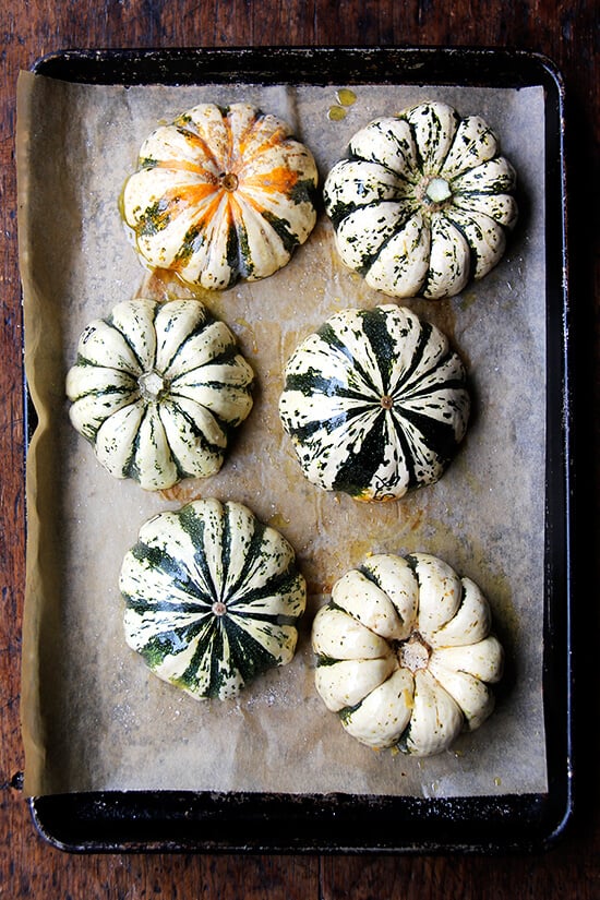 6 acorn squash halves, cut side down on a parchment-lined sheet pan. 