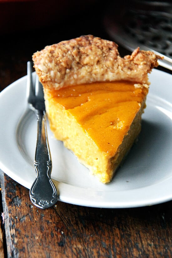 A slice of butternut squash pie on a plate.