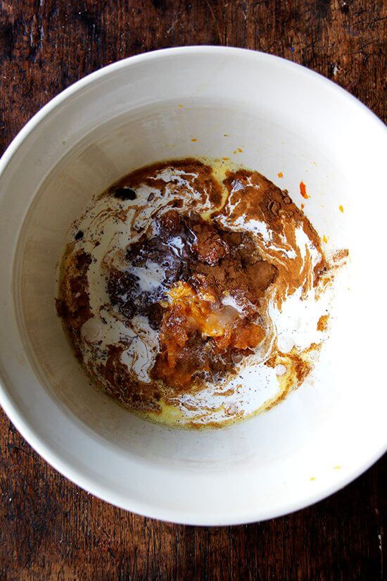 Butternut squash pie filling ingredients in a large bowl. 