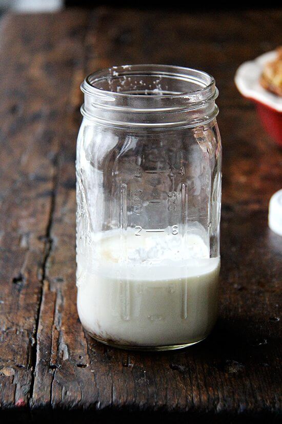 A mason jar filled with cream and sugar.