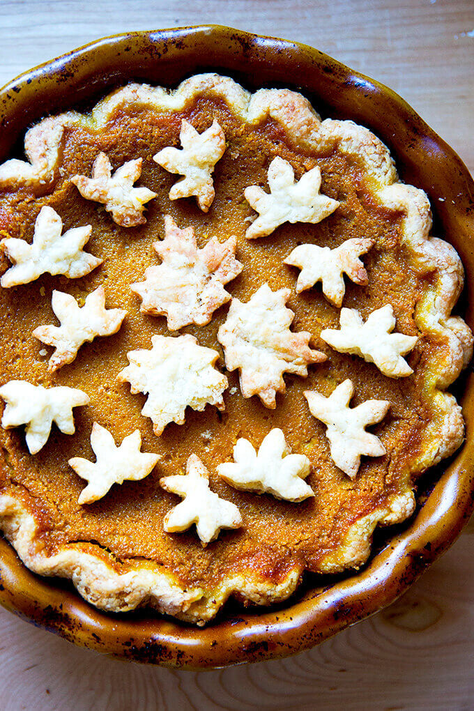 An overhead shot of butternut squash pie topped with pie crust cookies.