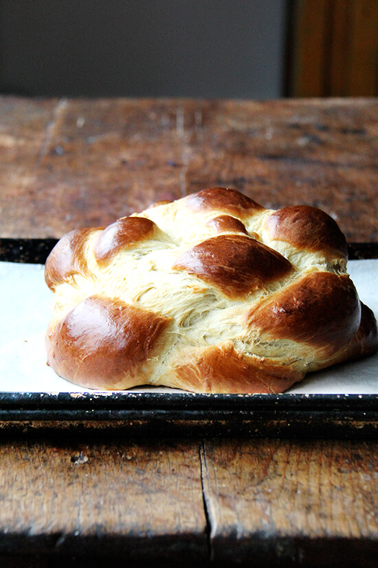 Just-baked challah bread on a sheet pan.