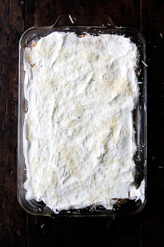 A 9x13-inch pan filled with unbaked butternut squash lasagna, ready for the oven.