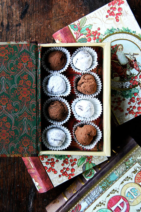 A decorative box holding homemade chocolate truffles. 