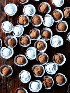 Overhead shot of boozy chocolate truffles on a table.