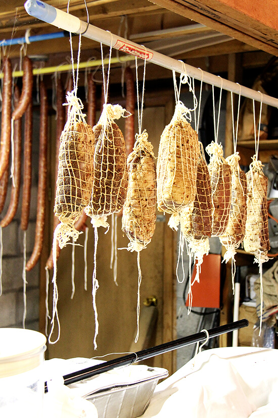 Homemade sausages hanging from the ceiling of Antonietta's basement. 